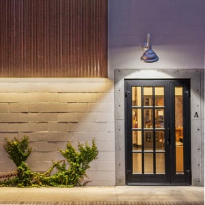 Modern architecture materials display a revitalized entrance with light fixtures above the doorway