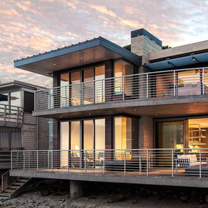 modern beach house on the sand with expertly designed exterior and interior