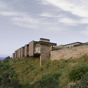 Modern Hillside Home of clad with dry stacked stone and ceramic architectural wall panel details