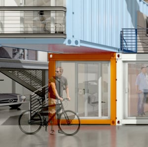 Photo of a person in front of a shipping container office, that is a modular structure
