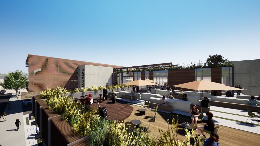 Rooftop terrace with outdoor seating and performance space highlights modern urban planning focused on communal experience.