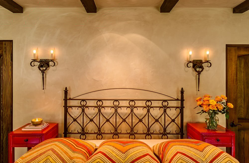 Ironwork details and textured walls speak to the handcrafted spirit of traditional home design and architectural heritage.