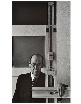 Photograph of Piet Mondrian, whose minimalist grid compositions inspired the aesthetic strategy for the building's sustainable facade.