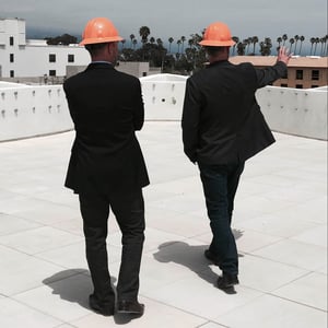 Two urban planners surveying the city