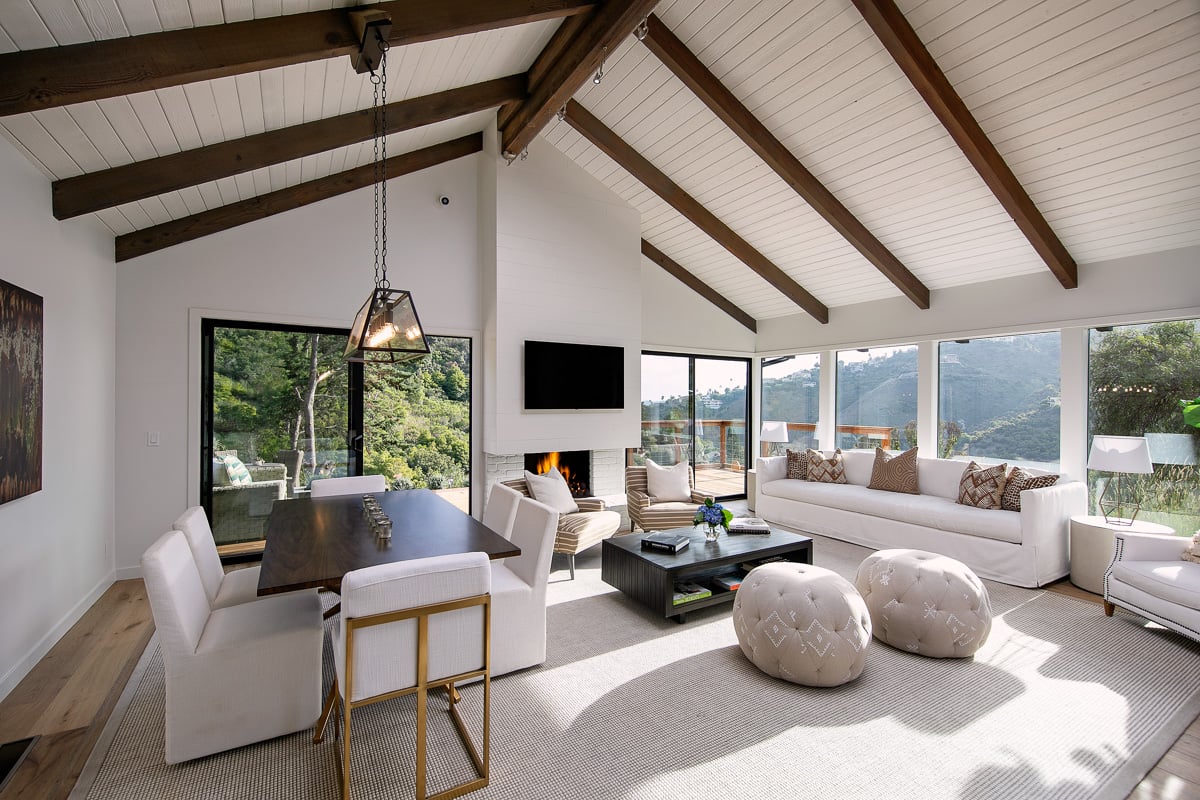 Elegant post-remodel living room with panoramic views and vaulted ceiling, exemplifying elevated residential interior design after remodeling.