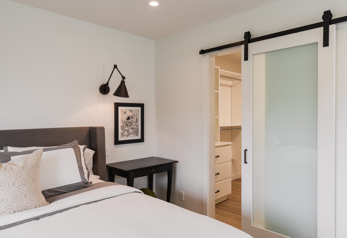 Bedroom featuring clean residential interior design elements and efficient space planning in a recent remodeling project.