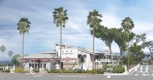 An artist illustration of the proposed Surfliner Inn located in Carpinteria California. The rendering shows tourists, beach goers and diners enkoying a delightful sunny summer day along the coast abutting the amtrack railway.