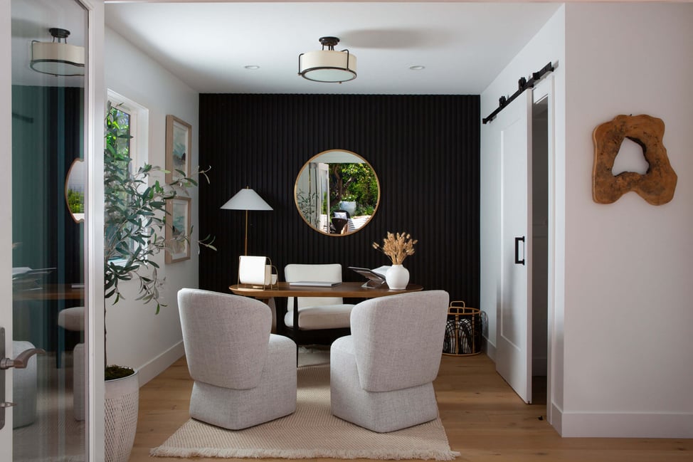 Elegant residential interior design featuring a remodeled workspace with statement decor and natural light.