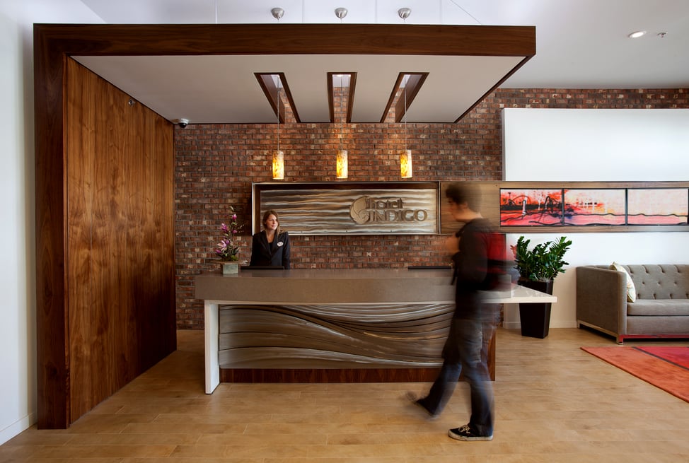 Boutique hotel reception at Hotel Indigo Santa Barbara, showcasing modern lobby design and custom architectural detailing.