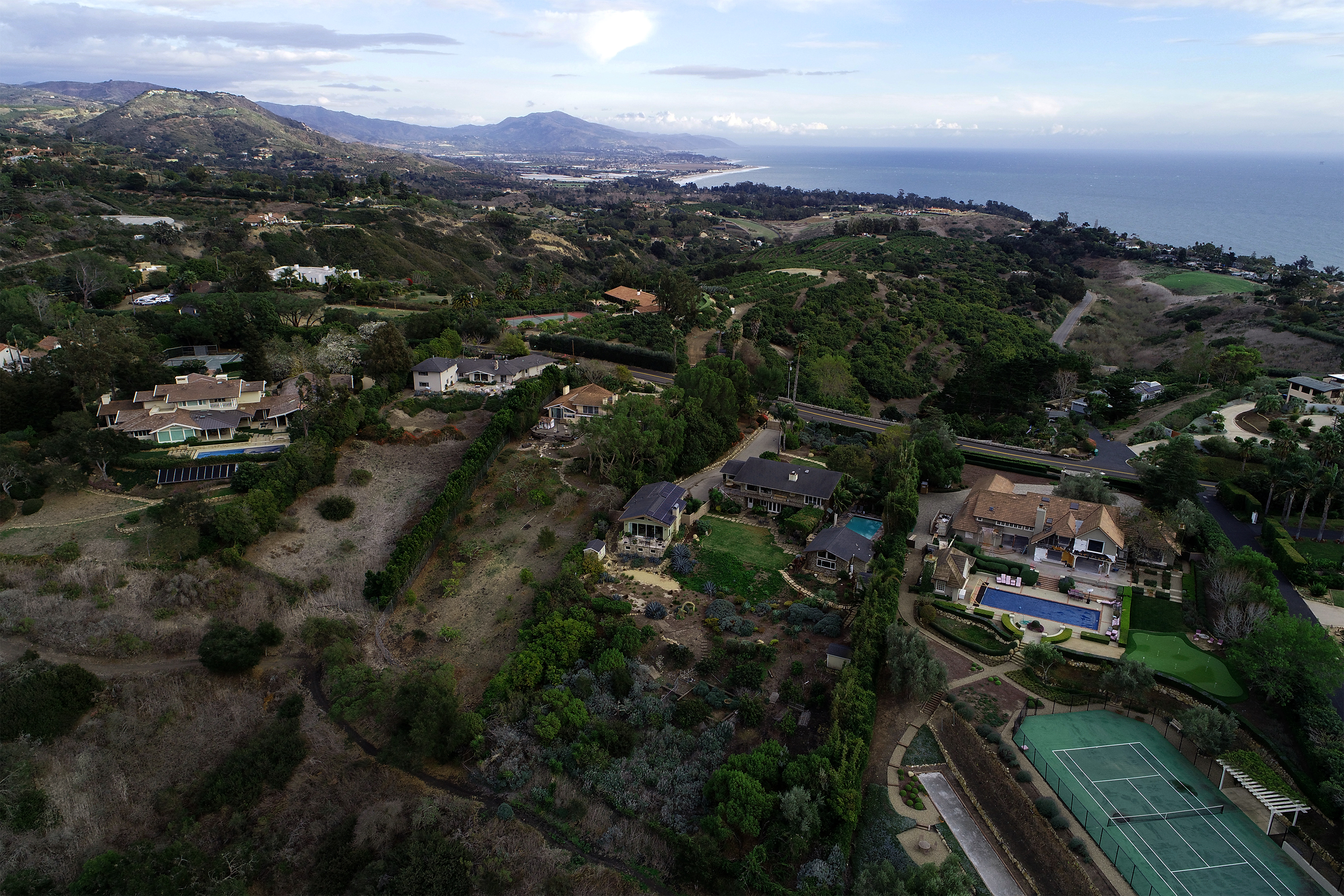 Aerial view of coastal hillside residential real estate in Montecito, a sought-after location for high-end modern house design.