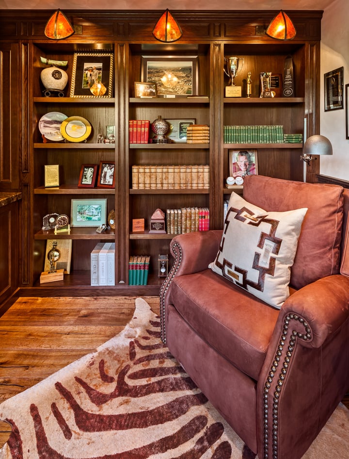 Lounging chair with personal bookcase designed to compliment the interior.
