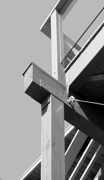 Structural detail of a timber support beam illustrating the construction integrity of a mid-century modern deck.