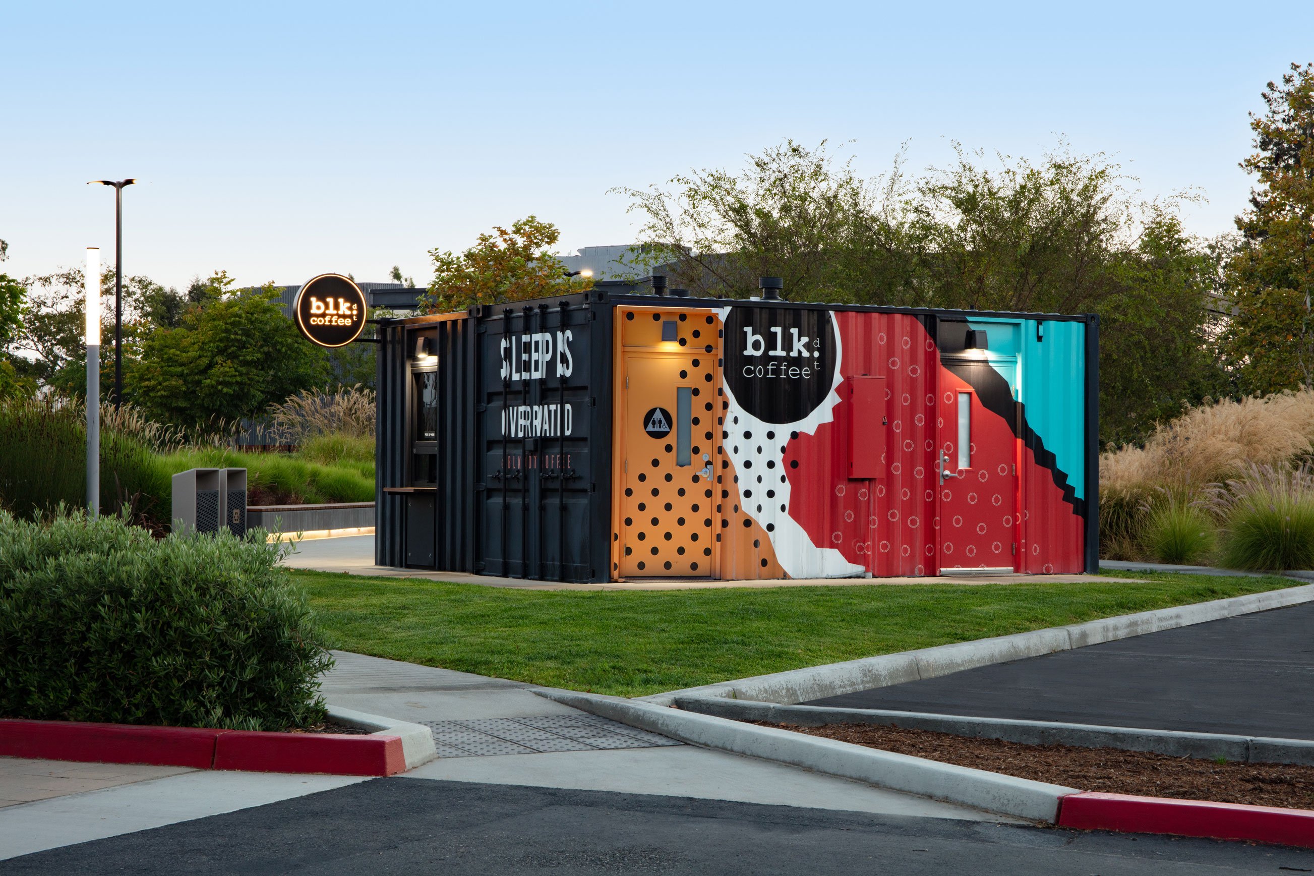 Rear view of VKCC with a vibrant mural, demonstrating the expressive potential of commercial modular construction.