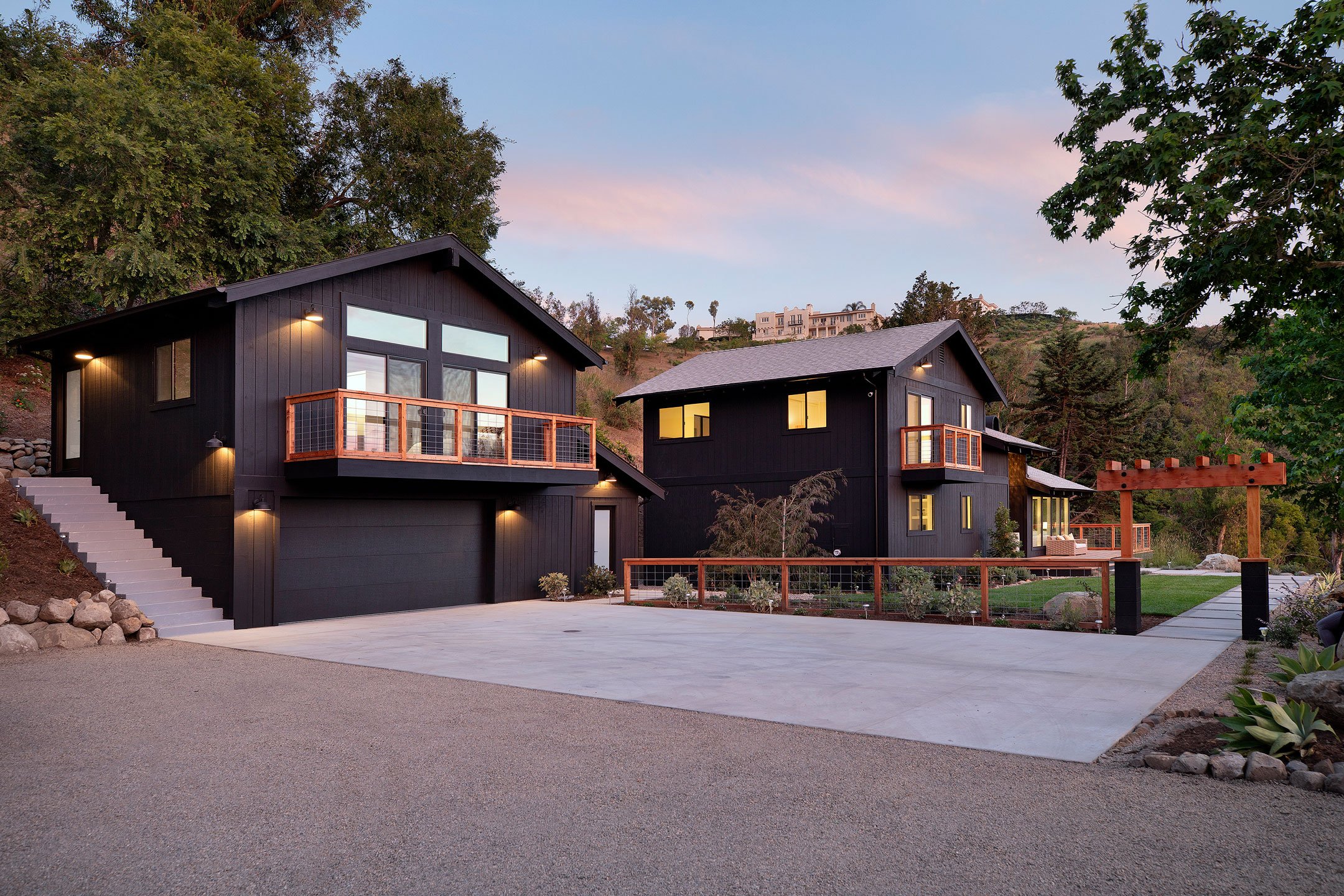 Rear exterior view of the Montecito property highlighting both the main residence and accessory unit, designed with open concept interiors and maximized outdoor connections.