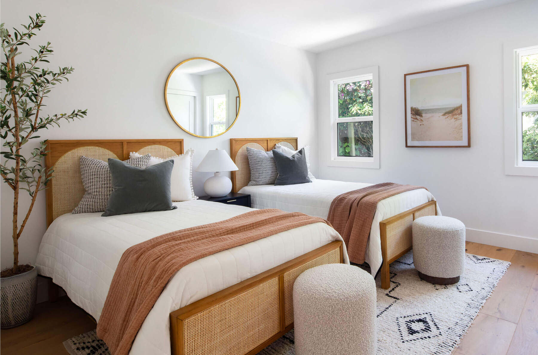This serene guest space merges modern interior design with organic textures for a fresh residential look.