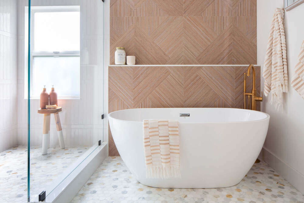 This modern bathroom blends organic tones and clean lines for a serene residential interior experience.