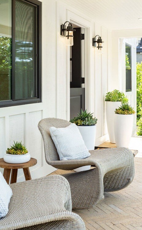 A cozy outdoor sitting area showcases natural textures and modern interior style extended into residential exteriors.