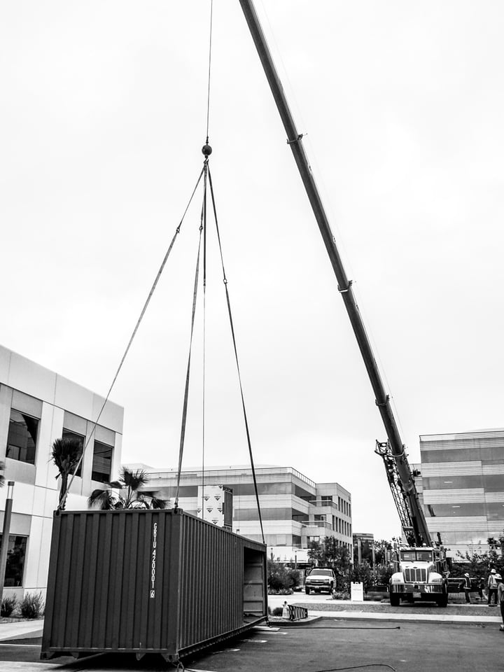 Container Pavilion at Intersect-14-shipping container being craned in