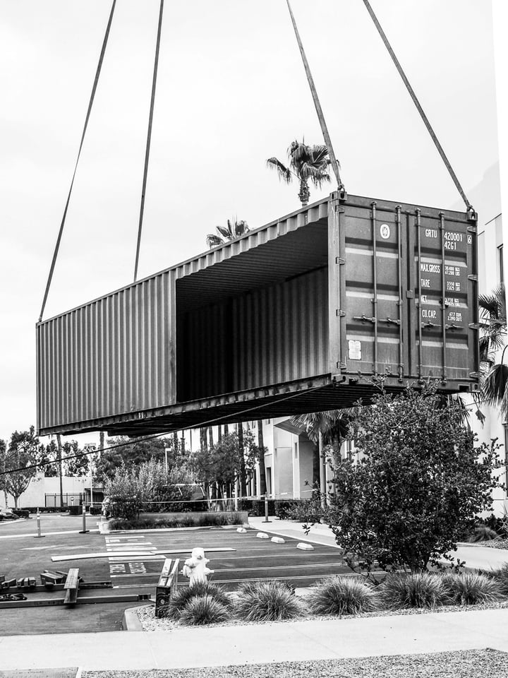 Container Pavilion at Intersect-15-shipping container being craned in