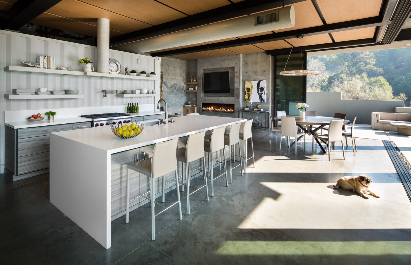 Shipping Container Residence-4-open kitchen and living room open to patio via large sliding door system