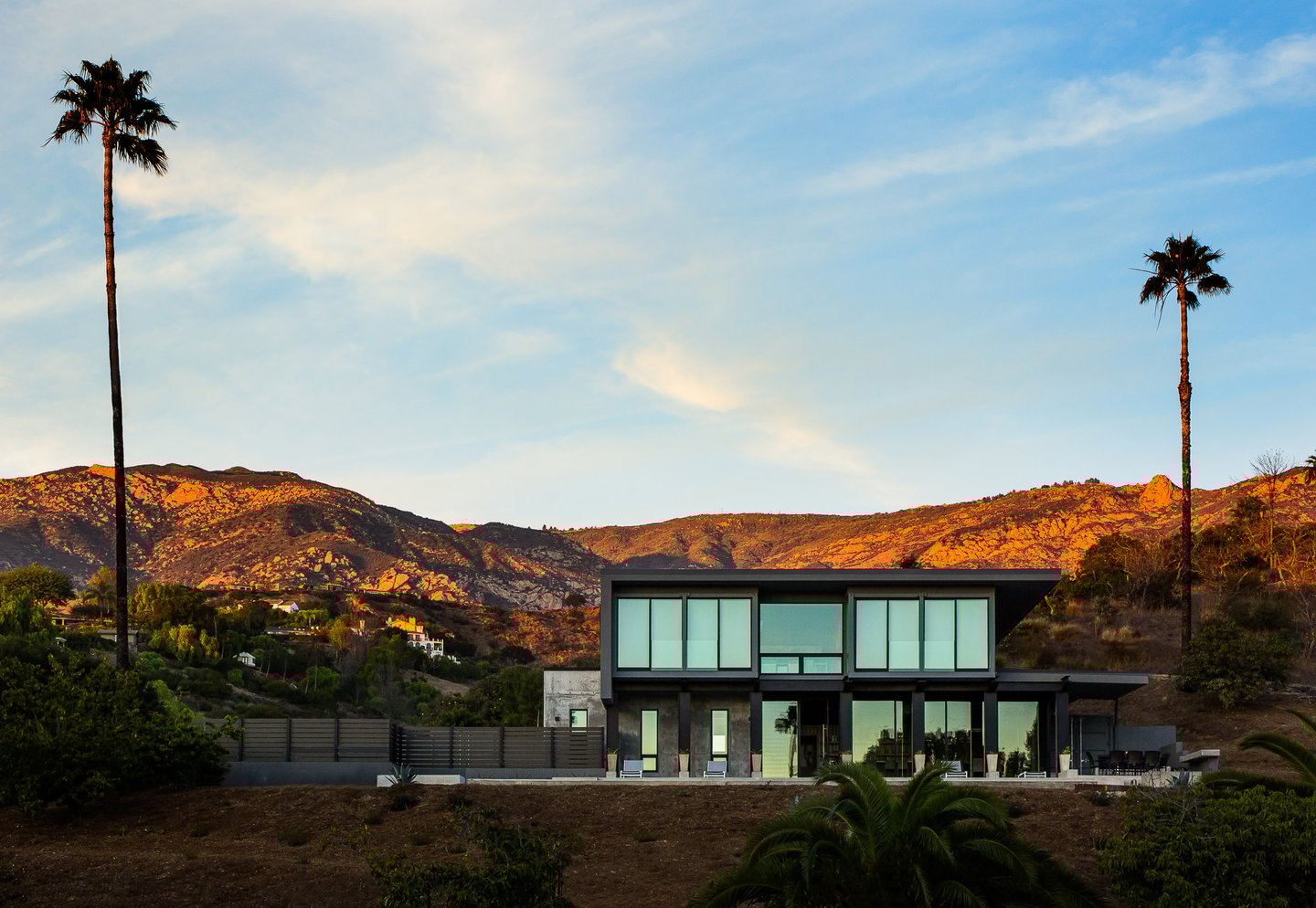 Shipping Container Residence-9-south elevation at sunset from distance