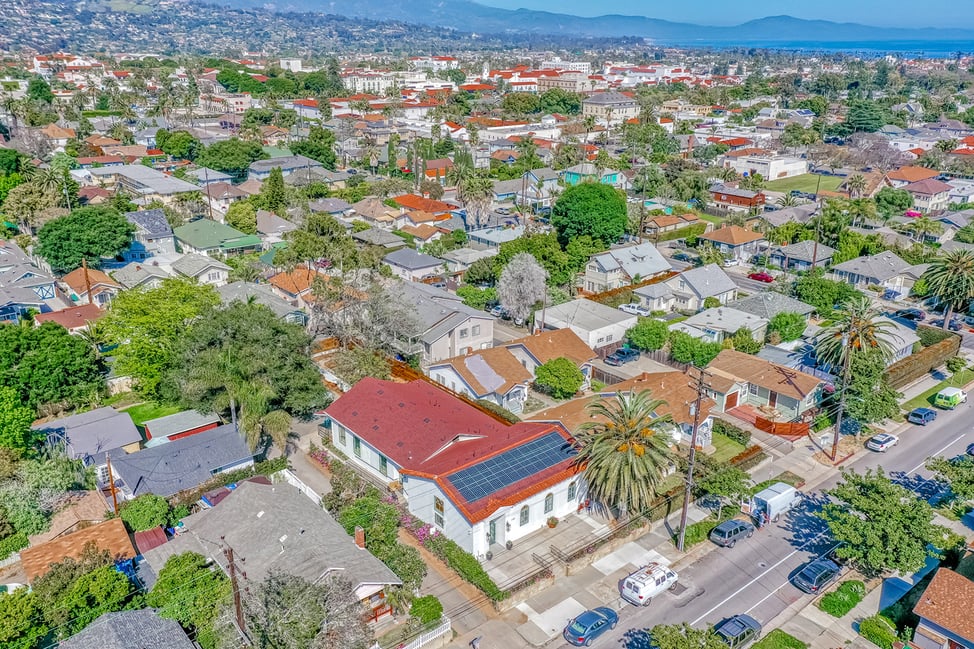 Aerial view of a residential neighborhood in Santa Barbara, highlighting the adaptive reuse of a historic building into a boutique hotel.