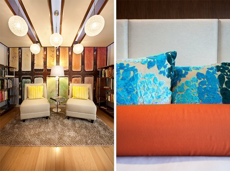 Detail of Hotel Indigo’s eclectic reading lounge and plush guest bedding, emphasizing the layered textures and intimate feel of boutique hotel design.