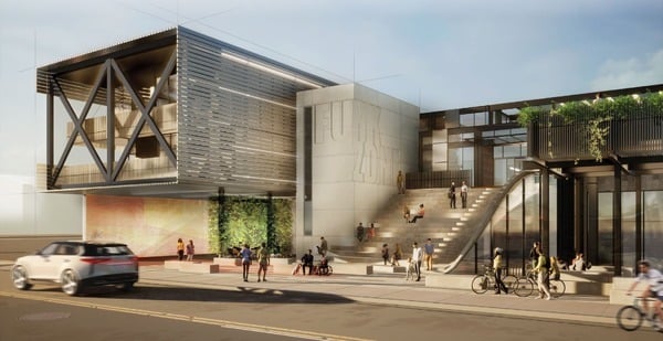 Modern civic building with stepped plaza, pedestrians, cyclists, and layered contemporary façade.